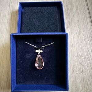 Swarovski necklace in pinkish or peachy color